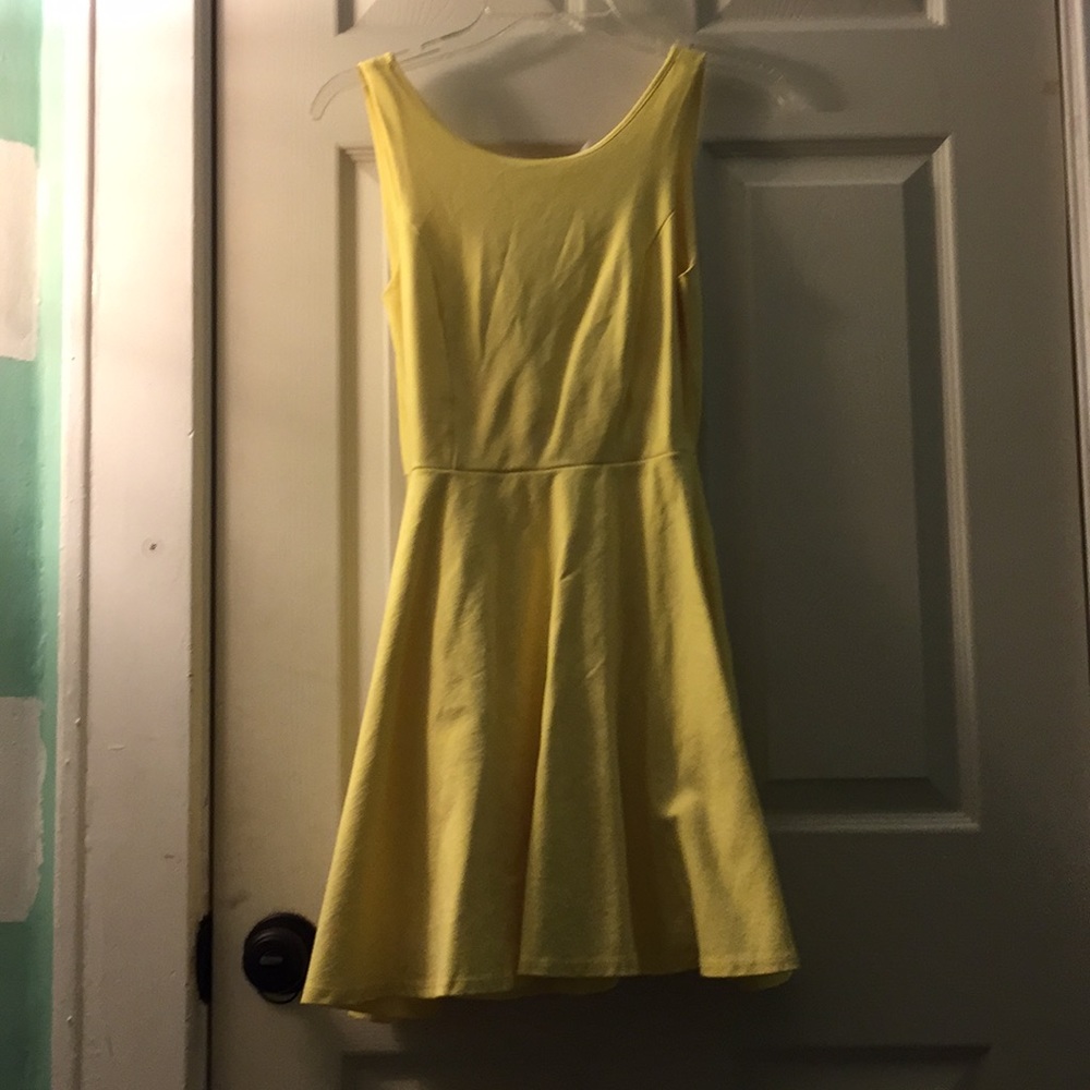 Yellow sleeveless skater dress